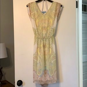 White dress with green, blue and tan design